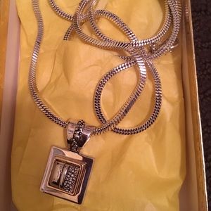 Gold and silver tone pendant with necklace